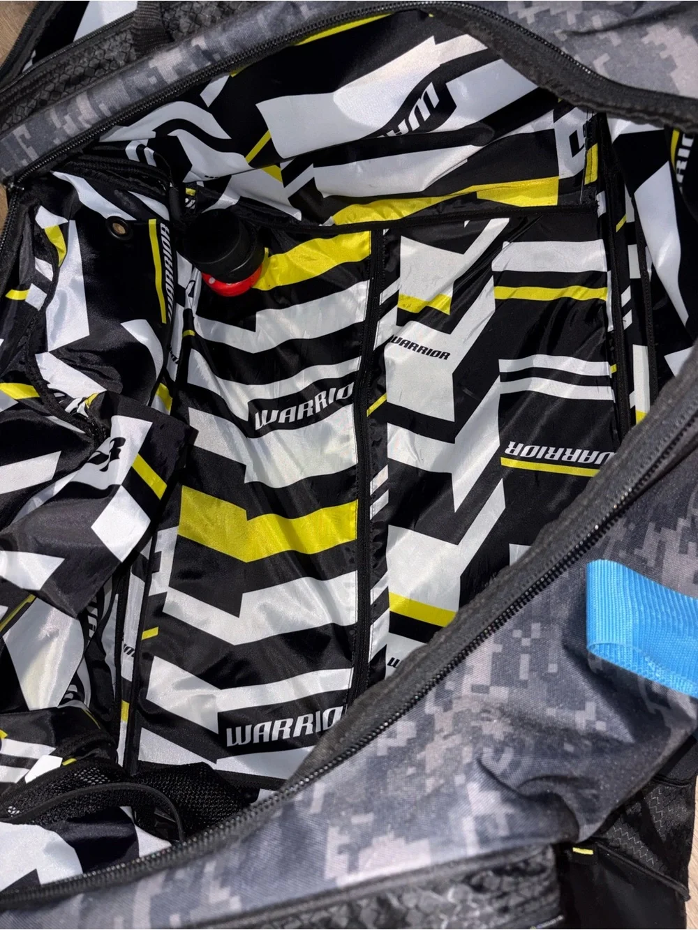Men's hockey Duffle Bag in Black Digital Camo with Blue Accents wheeled